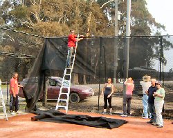 volunteers putting up screening